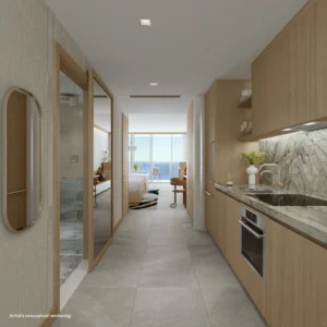 Cocina moderna en suite de W Pompano Beach con acabados de lujo y vista al mar desde el dormitorio