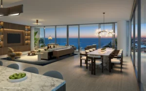 Sala y comedor de lujo en W Pompano Beach con vista panorámica al océano al atardecer y ventanales de piso a techo